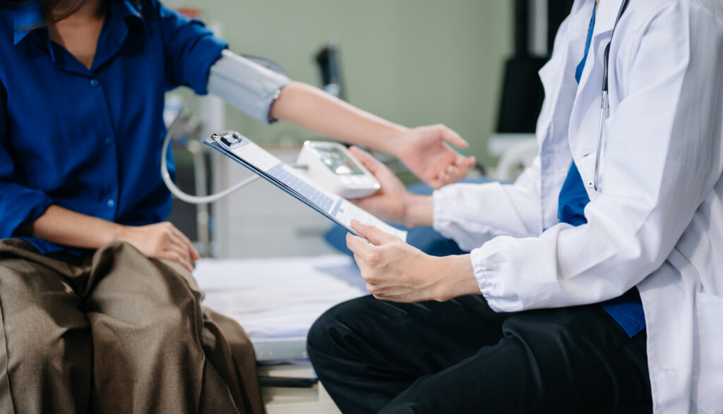 Doctor examining patient with symptoms in a clinic. Medical consultation and healthcare interaction. Ideal for healthcare, doctor visits, and patient care visuals