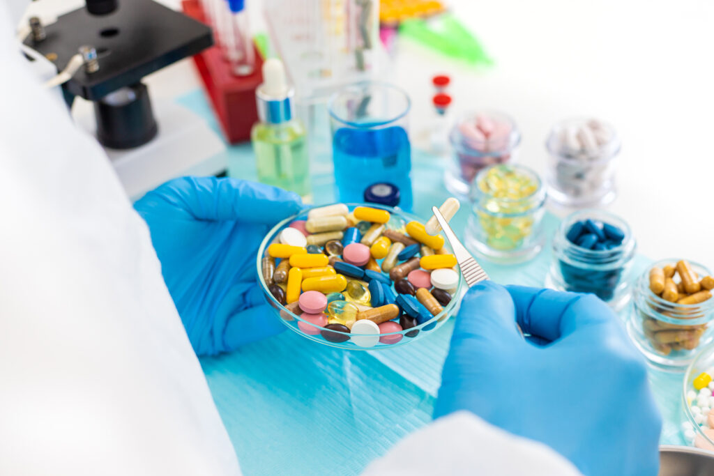 examine drugs in the laboratory. Selective focus. pills.