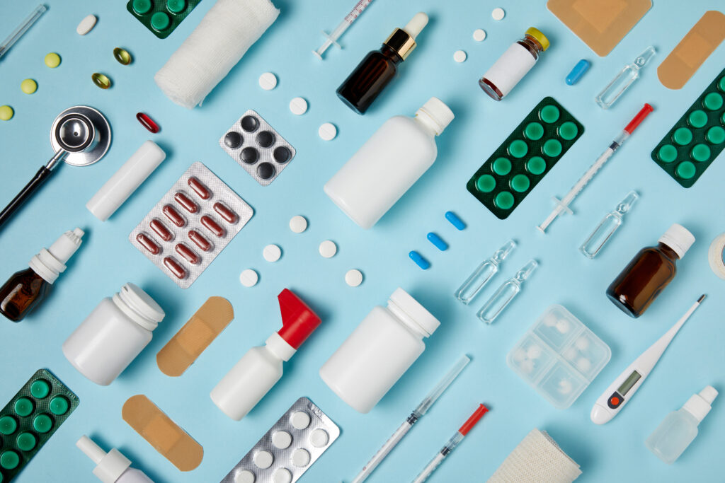 full frame shot of composed various medical supplies on blue surface