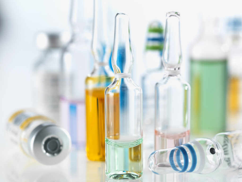 Variety of drugs including vials, ampules and vaccines illustrating medical research
